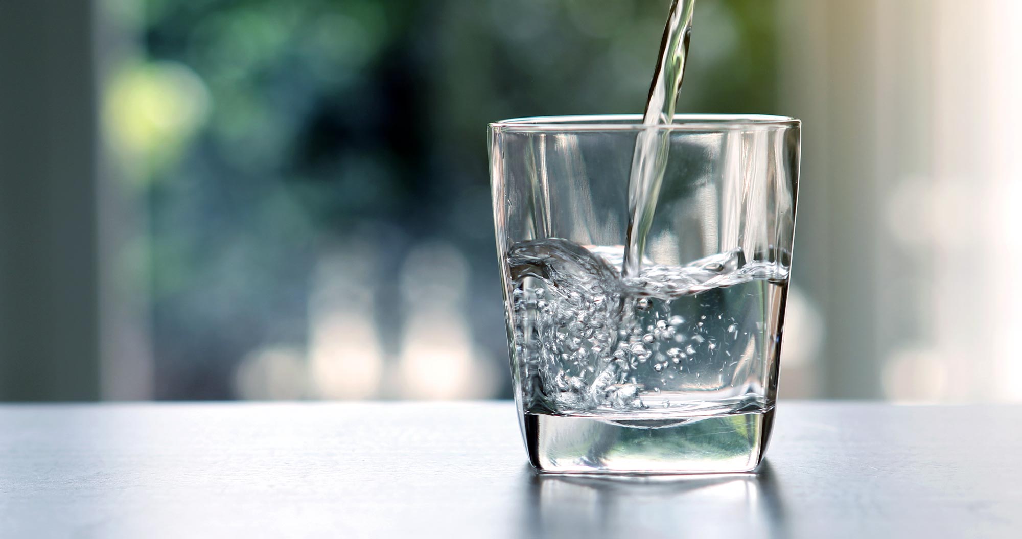 water being poured into glass.